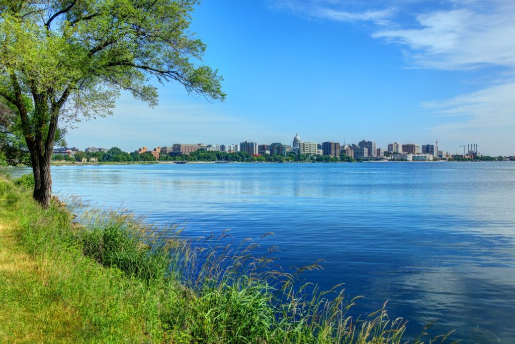 Madison skyline with lake and greenery view.