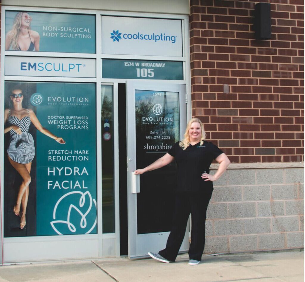 Woman outside Evolution Body Transformation clinic entrance.