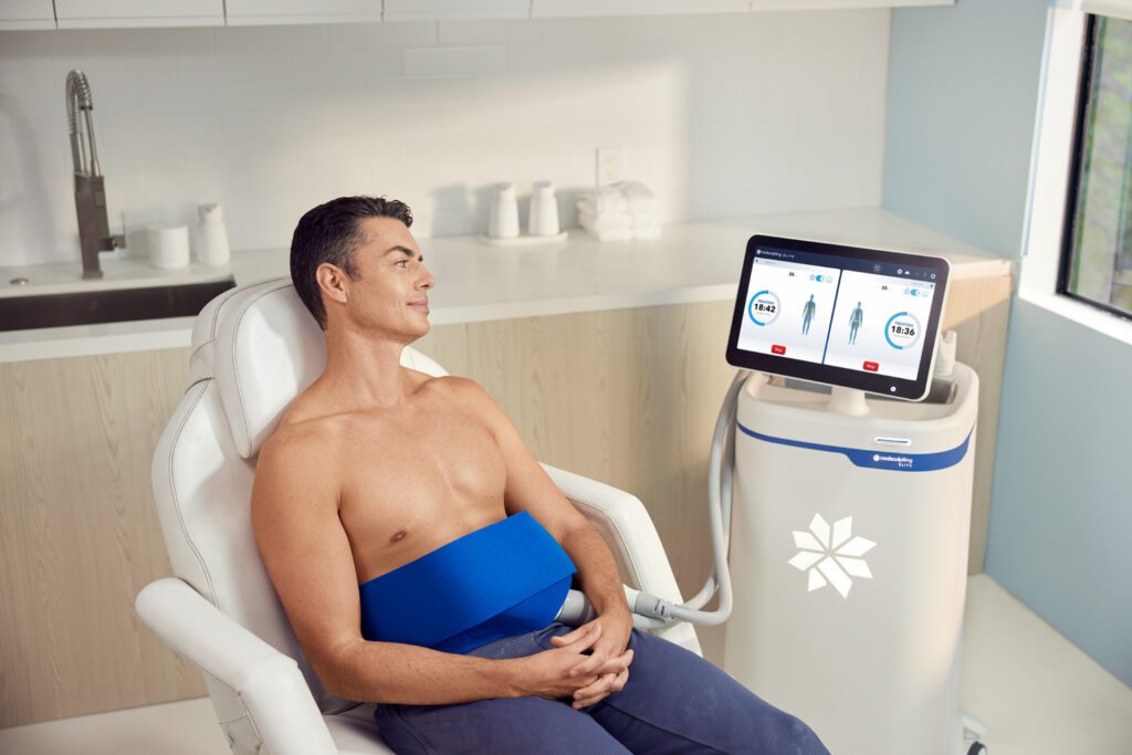 Man receiving CoolSculpting treatment in clinic